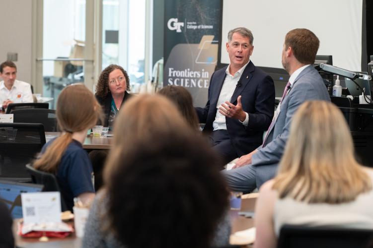 R. Shane Kimbrough speaks in front of room of people during a fireside chat